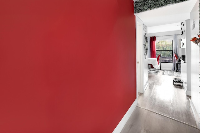 3750 NW 73rd Way, Coral Springs, FL 33065 - hallway featuring wood finished floors and baseboards
