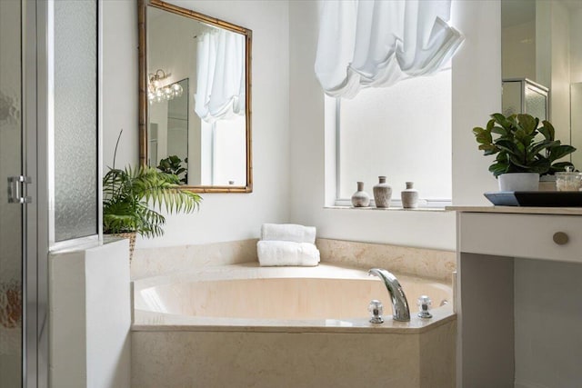 9961 SW Glenbrook Dr, Port Saint Lucie, FL 34987 - bathroom with a bath, vanity, and a shower stall