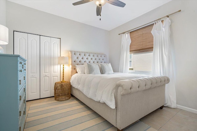 9961 SW Glenbrook Dr, Port Saint Lucie, FL 34987 - bedroom with light tile patterned floors, a closet, baseboards, and ceiling fan