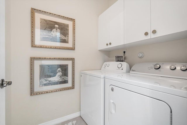 9961 SW Glenbrook Dr, Port Saint Lucie, FL 34987 - washroom featuring washer and clothes dryer, cabinet space, and baseboards