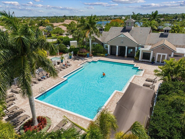 9961 SW Glenbrook Dr, Port Saint Lucie, FL 34987 - community pool with fence and a patio area