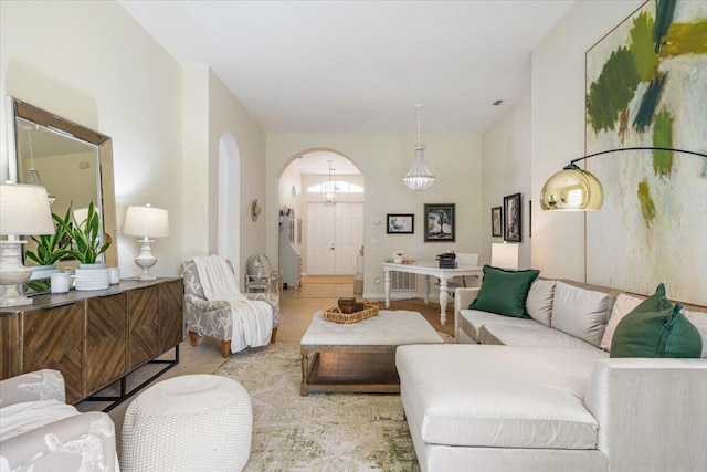 9961 SW Glenbrook Dr, Port Saint Lucie, FL 34987 - living area featuring tile patterned floors and arched walkways