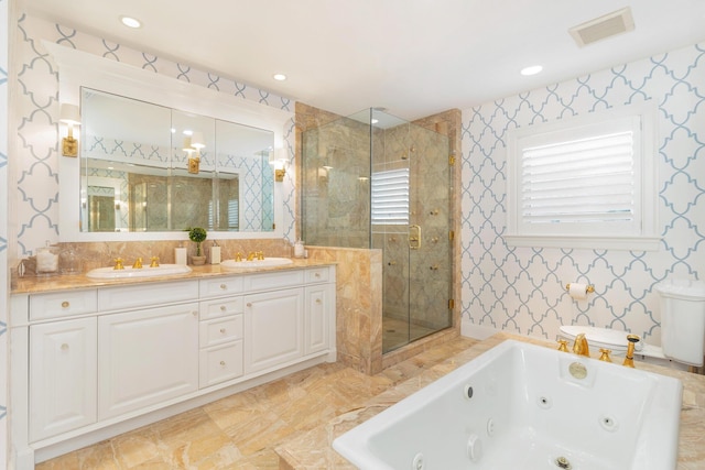 bathroom featuring visible vents, a sink, a stall shower, and a tub with jets