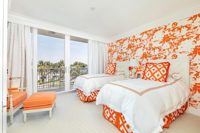 carpeted bedroom featuring crown molding, access to outside, and wallpapered walls