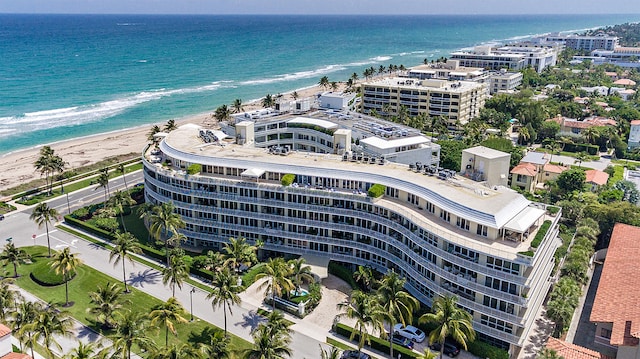 aerial view featuring a view of the beach and a water view
