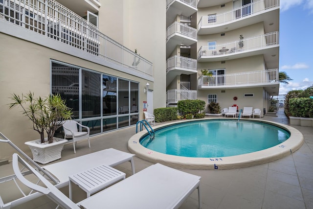 community pool featuring a patio