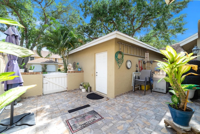 902 Maplewood Dr, Greenacres, FL 33415 - view of patio featuring a gate and fence