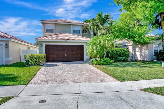 9506 Fox Trot Ln, Boca Raton, FL 33496 - mediterranean / spanish-style house with stucco siding, a tiled roof, driveway, and a front yard