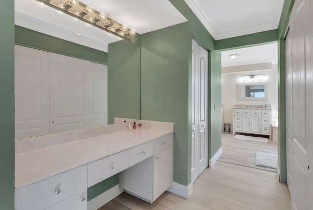 9506 Fox Trot Ln, Boca Raton, FL 33496 - bathroom featuring vanity, crown molding, baseboards, and wood finished floors