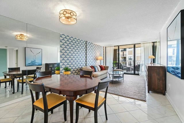dining area with plenty of natural light, baseboards, and a textured ceiling