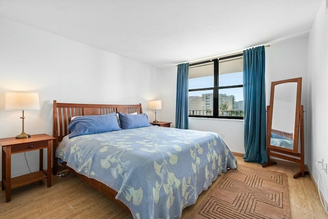 bedroom featuring light wood-style floors