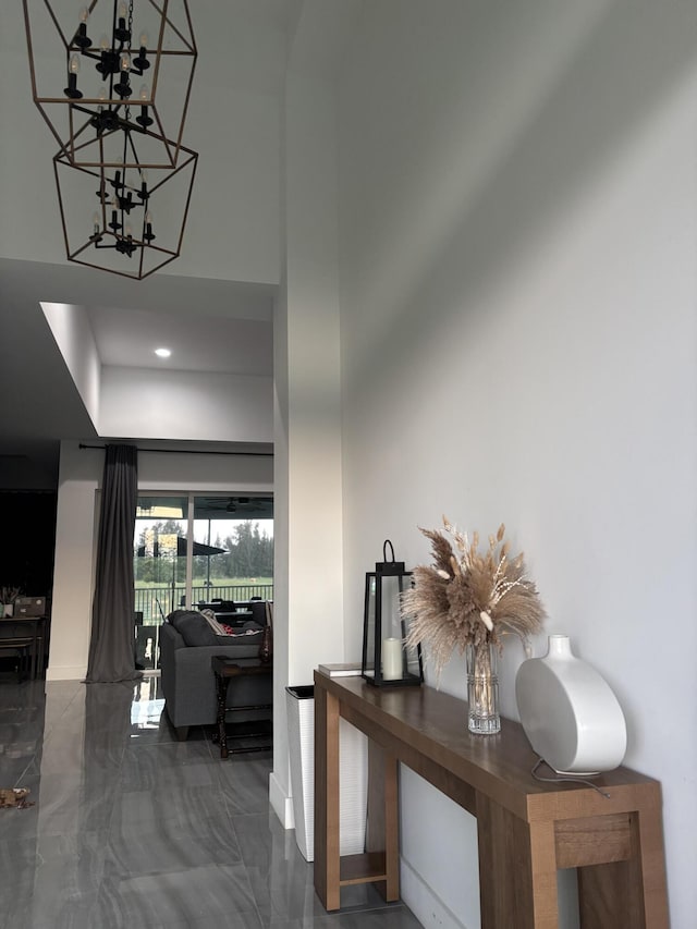 1071 S Header Canal Rd, Fort Pierce, FL 34945 - foyer featuring a chandelier, marble tiled floors, baseboards, and recessed lighting