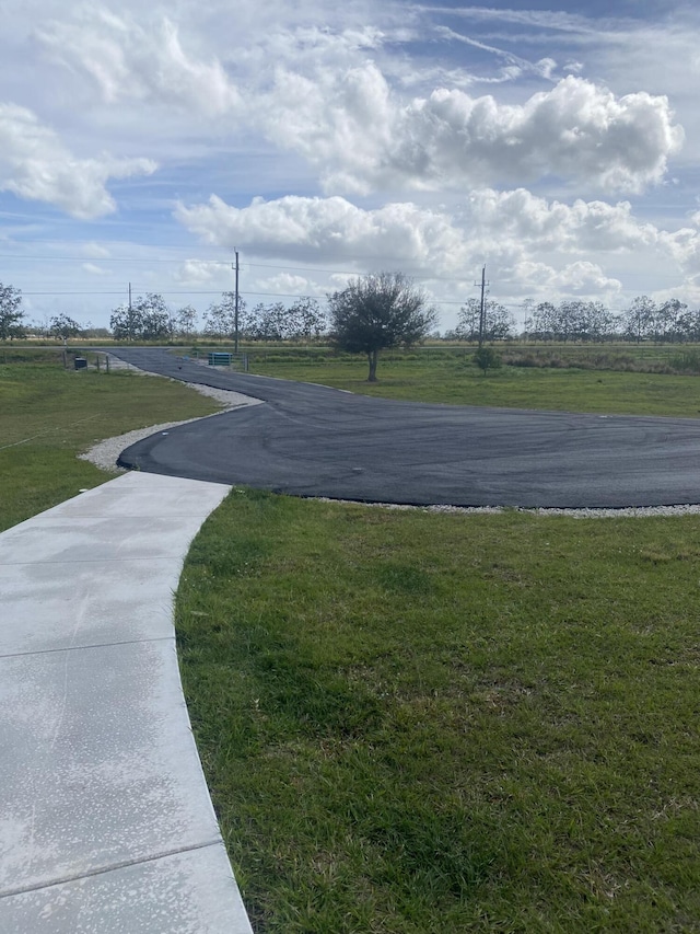 1071 S Header Canal Rd, Fort Pierce, FL 34945 - view of home's community featuring a lawn