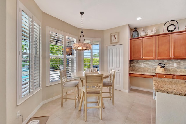 7147 Prudencia Dr, Lake Worth, FL 33463 - dining space featuring a chandelier, baseboards, light tile patterned floors, and recessed lighting