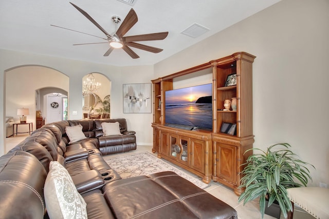 7147 Prudencia Dr, Lake Worth, FL 33463 - living room featuring a ceiling fan, arched walkways, and a chandelier
