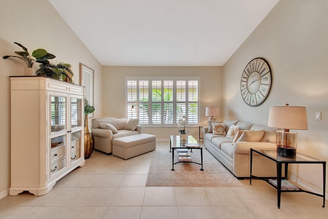 7147 Prudencia Dr, Lake Worth, FL 33463 - living area with lofted ceiling, light tile patterned floors, and baseboards