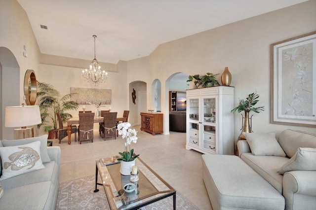 7147 Prudencia Dr, Lake Worth, FL 33463 - living room with arched walkways, a chandelier, and light tile patterned floors