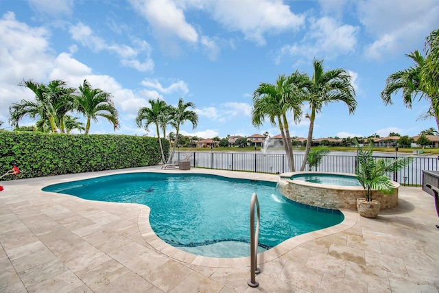 7147 Prudencia Dr, Lake Worth, FL 33463 - view of pool featuring a pool with connected hot tub, a patio, and a water view