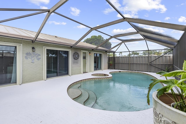 5652 Golden Eagle Cir, Palm Beach Gardens, FL 33418 - view of pool with a patio, a lanai, and a pool with connected hot tub
