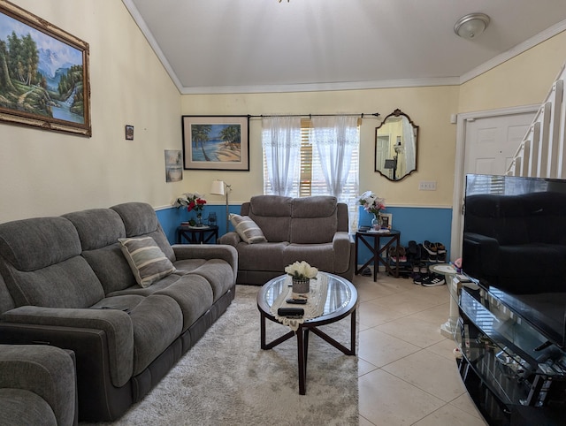 living area featuring crown molding and light tile patterned floors