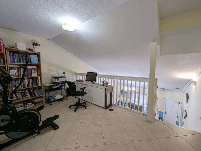office featuring tile patterned floors, visible vents, vaulted ceiling, and a textured ceiling