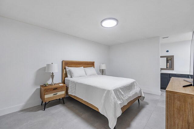 bedroom featuring baseboards