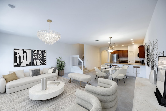 10403 Wellington Parc Dr, Wellington, FL 33449 - living area featuring concrete floors, arched walkways, a chandelier, recessed lighting, and stairs