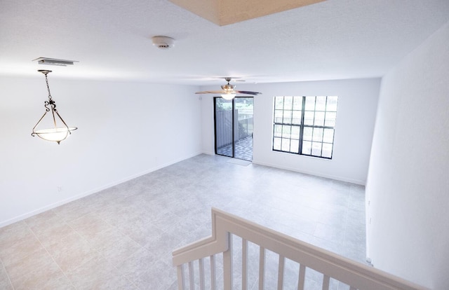 10403 Wellington Parc Dr, Wellington, FL 33449 - empty room with visible vents, baseboards, and a ceiling fan