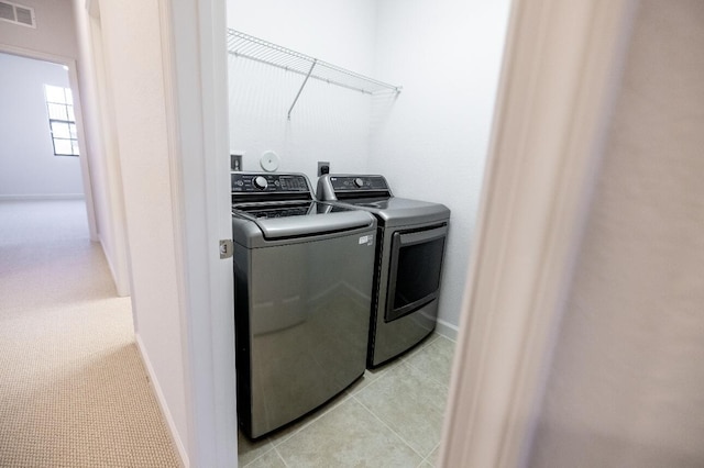 10403 Wellington Parc Dr, Wellington, FL 33449 - laundry area featuring baseboards, visible vents, independent washer and dryer, and laundry area