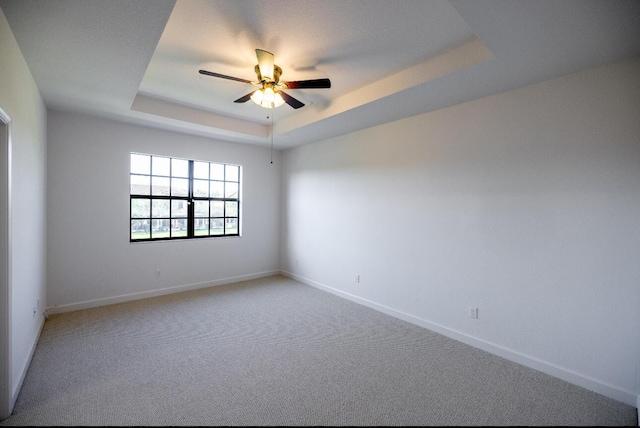 10403 Wellington Parc Dr, Wellington, FL 33449 - carpeted empty room with a raised ceiling, ceiling fan, and baseboards
