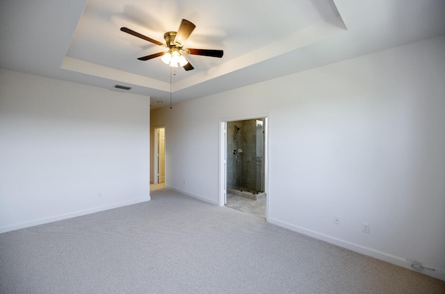 10403 Wellington Parc Dr, Wellington, FL 33449 - unfurnished room with a tray ceiling, ceiling fan, baseboards, and visible vents