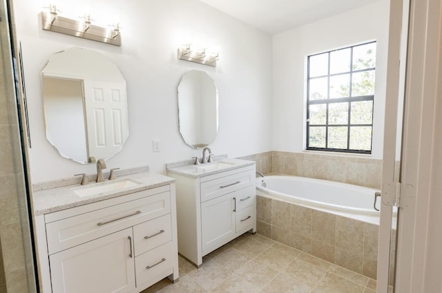 10403 Wellington Parc Dr, Wellington, FL 33449 - full bath featuring a sink, two vanities, tile patterned flooring, and a garden tub