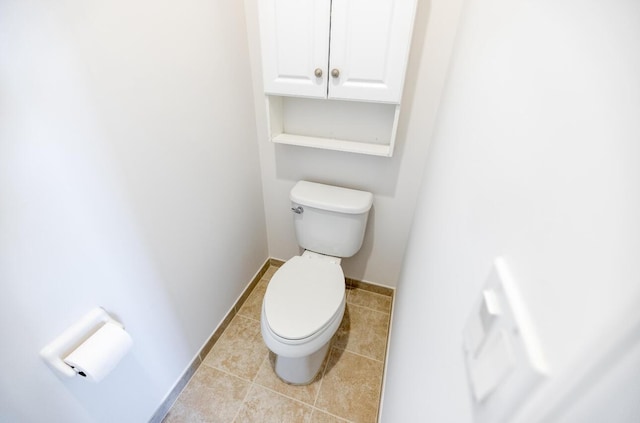 10403 Wellington Parc Dr, Wellington, FL 33449 - bathroom featuring tile patterned flooring, baseboards, and toilet