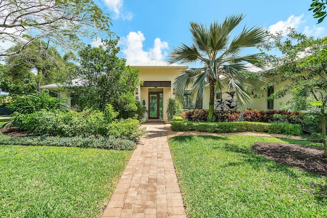 1125 NW 5th Ave, Delray Beach, FL 33444 - view of property hidden behind natural elements with a front yard and stucco siding