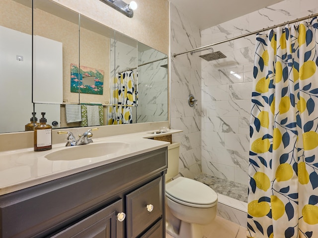 full bath with toilet, tiled shower, and vanity