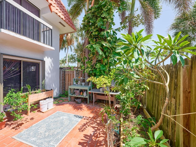 view of patio featuring fence