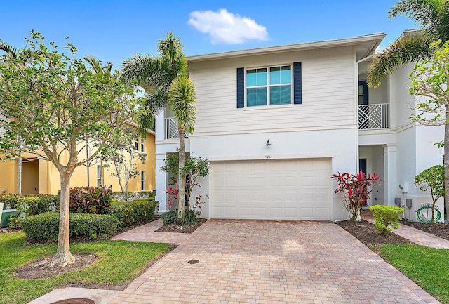 5264 Cambridge Ct, Palm Beach Gardens, FL 33418 - multi unit property featuring decorative driveway, stucco siding, and an attached garage