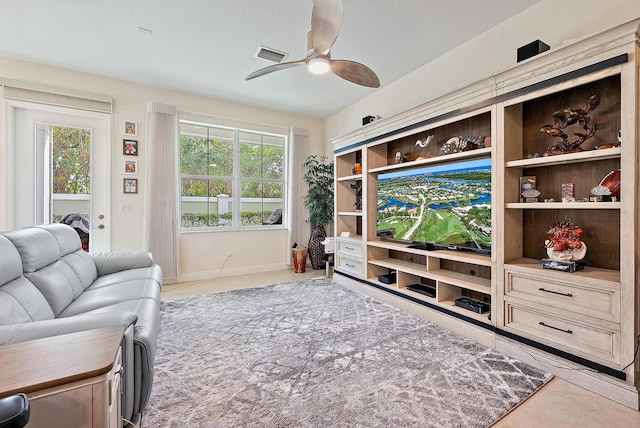 5264 Cambridge Ct, Palm Beach Gardens, FL 33418 - living room featuring a ceiling fan and baseboards