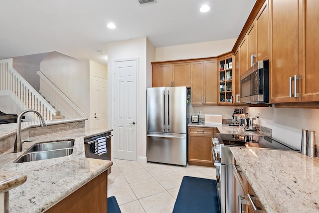 5264 Cambridge Ct, Palm Beach Gardens, FL 33418 - kitchen with appliances with stainless steel finishes, a sink, light tile patterned flooring, light stone counters, and recessed lighting