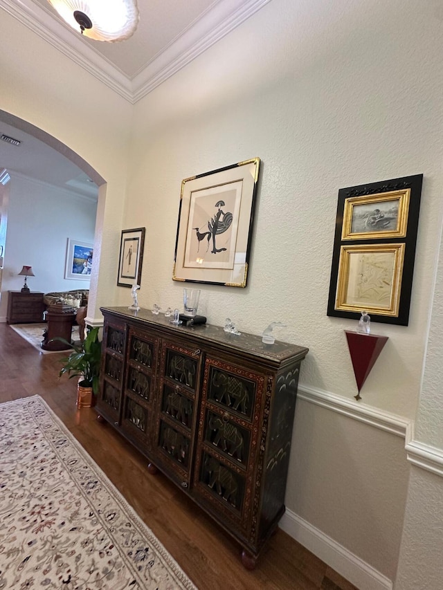 3112 Bollard Rd, West Palm Beach, FL 33411 - hall with arched walkways, wood finished floors, and ornamental molding