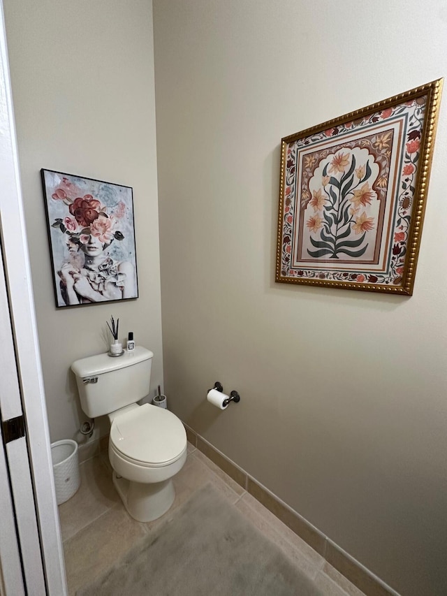 3112 Bollard Rd, West Palm Beach, FL 33411 - bathroom featuring toilet, tile patterned flooring, and baseboards