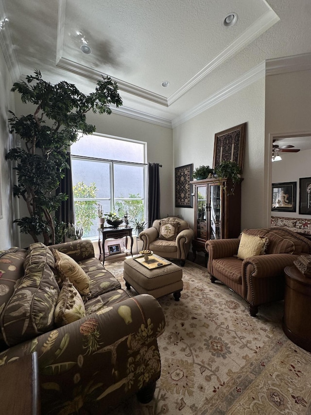 3112 Bollard Rd, West Palm Beach, FL 33411 - living area featuring ornamental molding, a raised ceiling, a textured ceiling, and ceiling fan