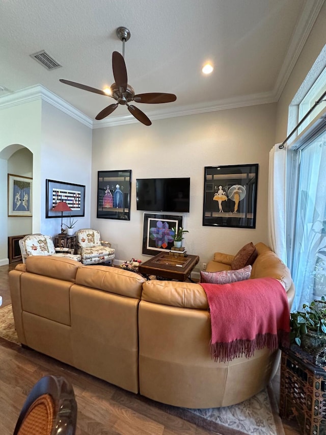 3112 Bollard Rd, West Palm Beach, FL 33411 - living area with wood finished floors, ornamental molding, ceiling fan, and arched walkways