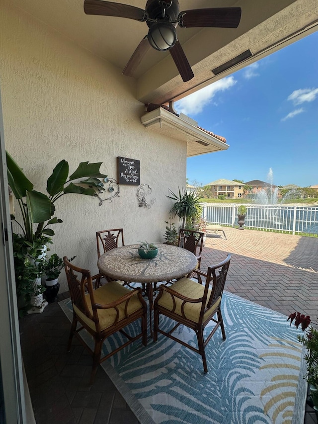 3112 Bollard Rd, West Palm Beach, FL 33411 - view of patio with a ceiling fan, outdoor dining space, and a balcony