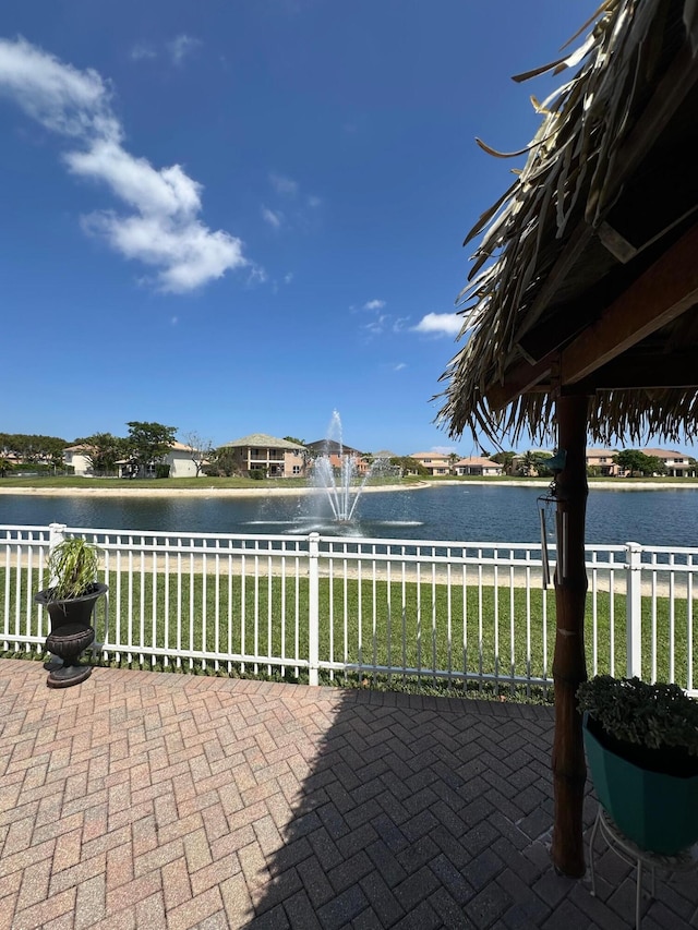 3112 Bollard Rd, West Palm Beach, FL 33411 - view of patio / terrace with a water view