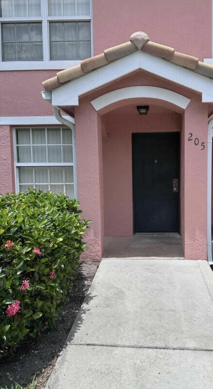 162 SW Peacock Blvd Unit 205, Port Saint Lucie, FL 34986 - doorway to property featuring stucco siding