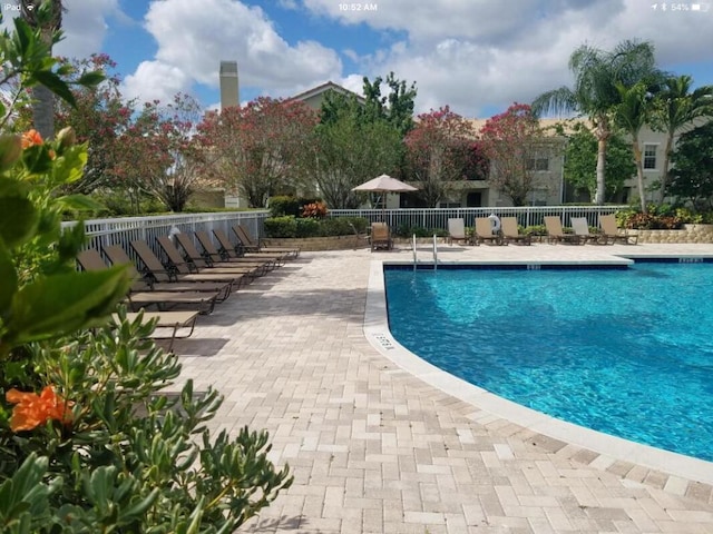 162 SW Peacock Blvd Unit 205, Port Saint Lucie, FL 34986 - community pool featuring a patio area