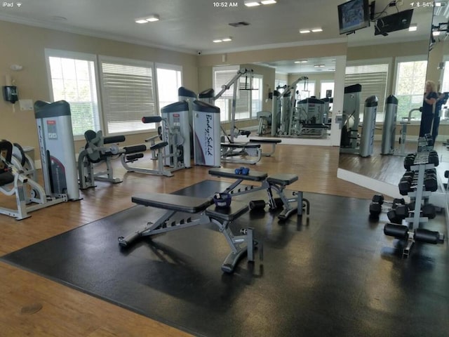 162 SW Peacock Blvd Unit 205, Port Saint Lucie, FL 34986 - gym with crown molding, healthy amount of natural light, and wood finished floors