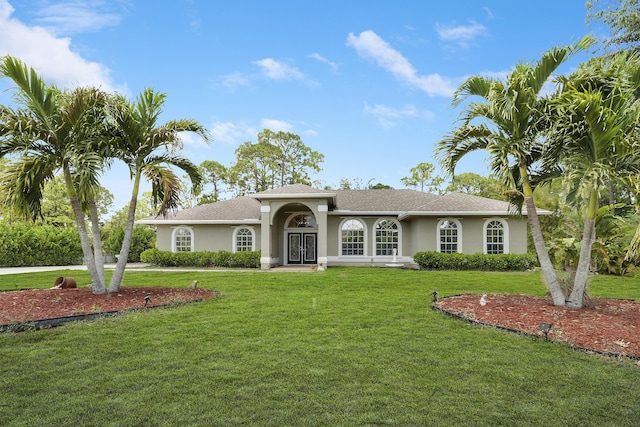 13209 Temple Blvd, West Palm Beach, FL 33412 - view of front of home with stucco siding and a front yard
