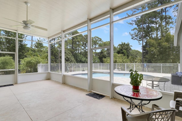 13209 Temple Blvd, West Palm Beach, FL 33412 - sunroom / solarium featuring ceiling fan and view of wooded area